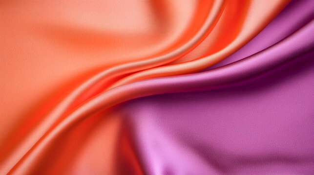Vibrant silk fabric in orange and purple hues, showcasing smooth texture and flowing elegance, perfect for various design projects.