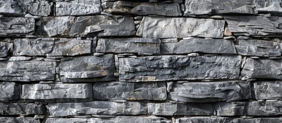 Naklejka premium Beautiful grey stone wall background with a symbolic adaptable workplace concept featuring a copy space image