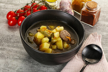 Soup with meatball and potato