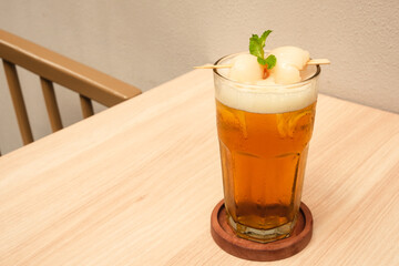 Lychee iced tea with mint leaves
