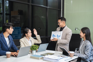 Business, technology and office concept, businessman with laptop, tablet pc computer and papers having discussion in modern office.