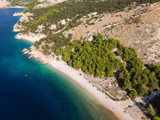 Aerial view of a wild pebble beach near Baška, Croatia