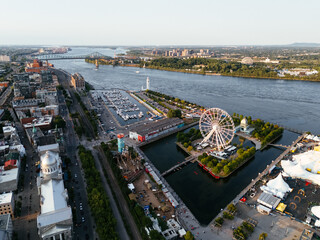 Drone view of Old Port City waterfront park with an entertainment venue and Jacques Cartier Bridge...