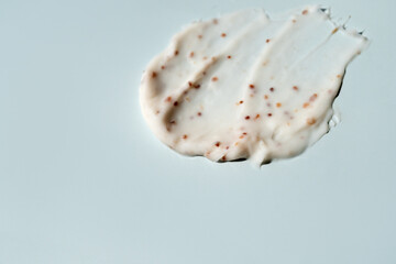 A smear of scrub on a light background. Beauty concept.