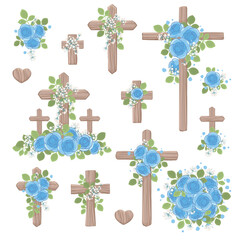 Wooden crosses of various sizes decorated with blue roses and leaves Christianity and Catholicism religion