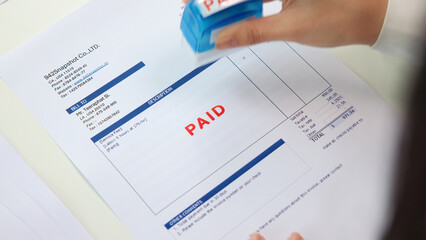 Worker busy work seal getting paying symbol on sales bill form report paper stack. Pay off full amount income tax fee past due date sale office job task. Cash flow debt credit loan risk control budget
