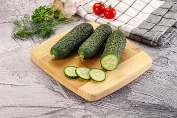 Raw green cucumbers with slices