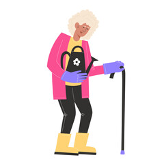 An elderly woman with a stick is standing and holding a watering can