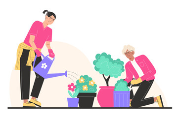 Grandfather and grandson plant and water flowers in pots in the garden