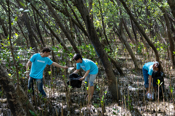 Team of young and diversity volunteer worker group enjoy charitable social work outdoor in cleaning...