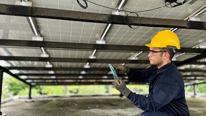 Technical engineer Inspecting the installation of the solar panels and checking the integrity of...