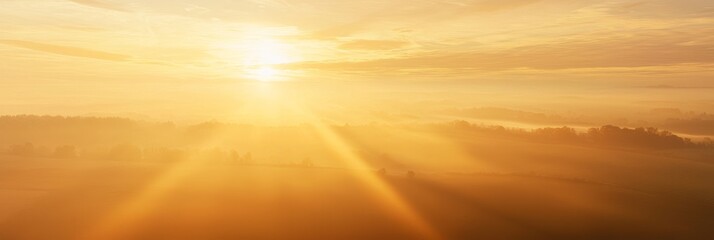 Fototapeta premium Early Morning Sky Soft Mist Golden Light Breaking Through