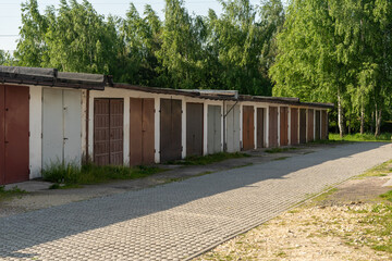 Rows of old garages with colorful metal doors in Poland village