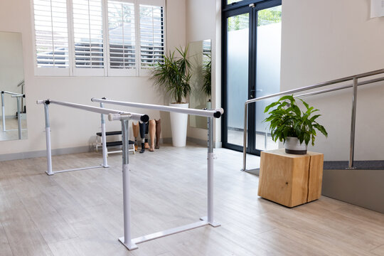 Parallel bars in prosthetic lab for rehabilitation and physical therapy sessions, copy space