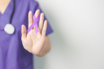 Doctor holding purple Ribbon for Violence, Pancreatic, Esophageal, Testicular cancer, Alzheimer,...