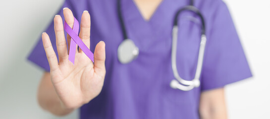 Doctor holding purple Ribbon for Violence, Pancreatic, Esophageal, Testicular cancer, Alzheimer,...