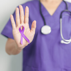 Doctor holding purple Ribbon for Violence, Pancreatic, Esophageal, Testicular cancer, Alzheimer,...
