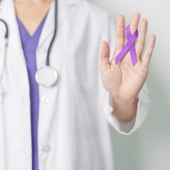 Doctor holding purple Ribbon for Violence, Pancreatic, Esophageal, Testicular cancer, Alzheimer,...