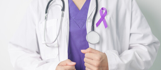 Doctor holding purple Ribbon for Violence, Pancreatic, Esophageal, Testicular cancer, Alzheimer,...