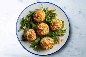Mushrooms stuffed with rice and vegetables. Top view table.