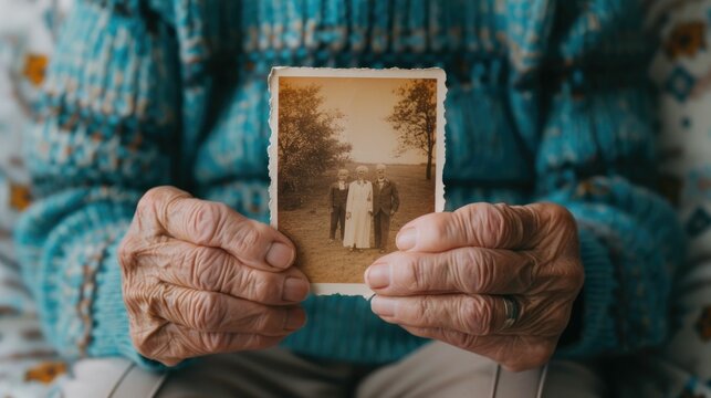 Heartwarming Moment as Grandparents Reveal Cherished Family History by Showing Old Photographs to Younger Relatives Preserving Memories and Strengthening Bonds