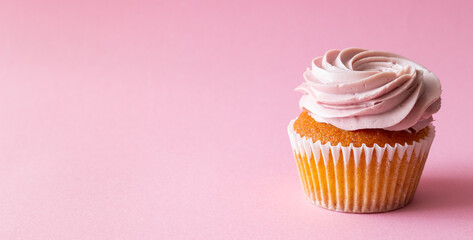 Cupcake on pink background. Dessert. Cooking. Baking. Vegetarian food.