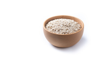 Rolled oats, healthy breakfast cereal oat flakes in bowl isolated on white background. Copy space