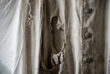 close up of old ripped white clothing