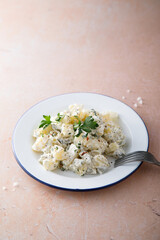 Homemade potato salad with pickles