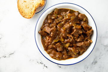 Beef ragout with pickled cucumber