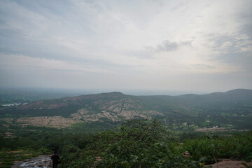 Aerial View of a Vast Landscape, Panoramic View of a Distant Valley, Scenic Landscape at Sunset Time, Misty Mountains and Rolling Hills Stock Photo.