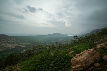 Aerial View of a Vast Landscape, Panoramic View of a Distant Valley, Scenic Landscape at Sunset Time, Misty Mountains and Rolling Hills Stock Photo.