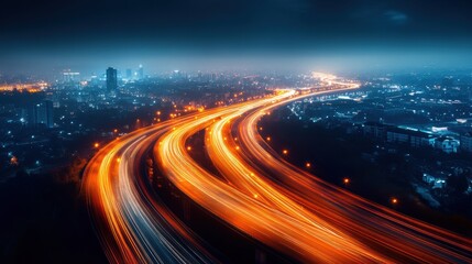 Fototapeta premium a sprawling urban landscape at night from an aerial perspective, with glowing city lights and traffic a network of light trails across highways and streets
