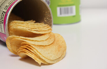 Open Can Of Potato Crisps on Light Colored Background