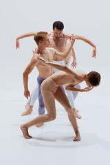 Dancers bend and reach, exercising their bodies to create art through synchronized, expressive...