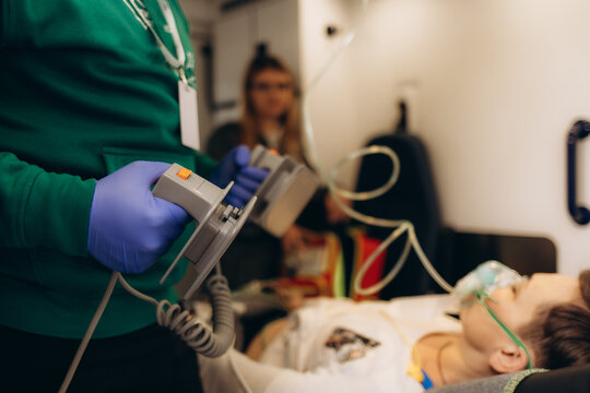 Paramedics questionnaire the patient and put him on a dropper