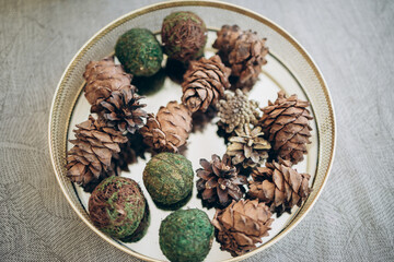 Interior decorated for Christmas and New Year, pine cones from a tree