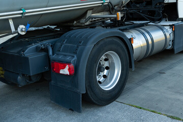 Fototapeta premium View of a tanker truck wheel and fuel tank.