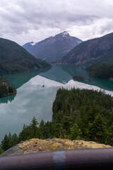 A stunning cloudy morning view of a glacial blue lake in North Cascades.