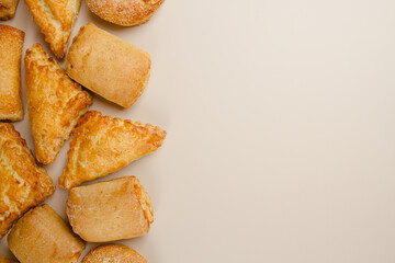Pastries on beige background. There is room for copy space