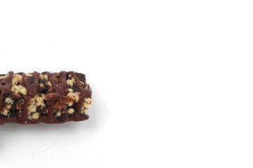 Crispy wafer coated with caramel and milk chocolate with isolated white background