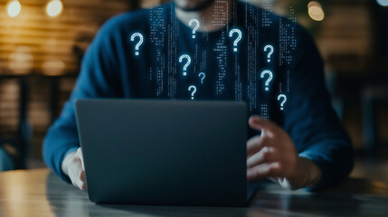 A man at a cafÃ© works on his laptop, with question marks made of digital code floating above the keyboard, symbolizing web development queries.