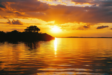 A Serene Sunset Paints the Sky and Sea with Golden Hues, Casting a Tranquil Glow Over the Water's Rippling Surface.