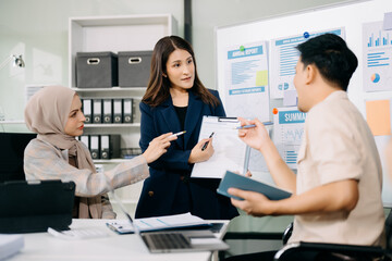 Group of Asian business meeting in planning design in creative business discussing work