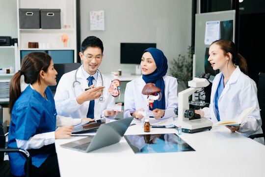 Medical, meeting and doctors with laptop for research, planning and hospital schedule management. Health, professional and people team for brainstorming in hospital