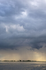 Clouds and rain over the river