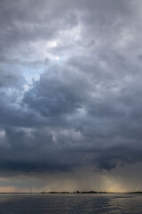 Clouds and rain over the river