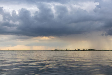 Clouds and rain over the river