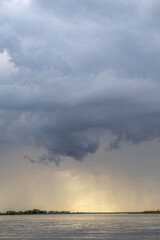 Clouds and rain over the river