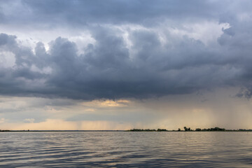 Clouds and rain over the river